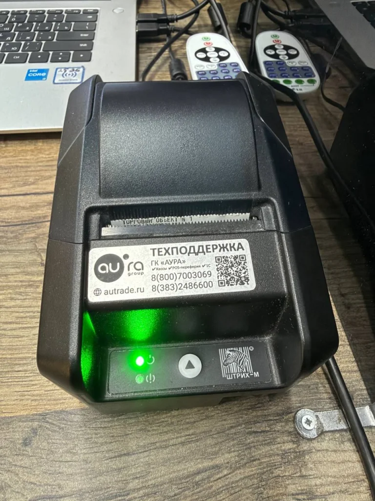 Касса с наклейкой технической поддержки
